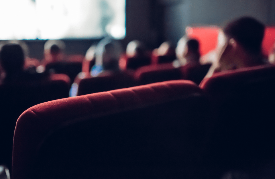 people watching a movie in a movie theater