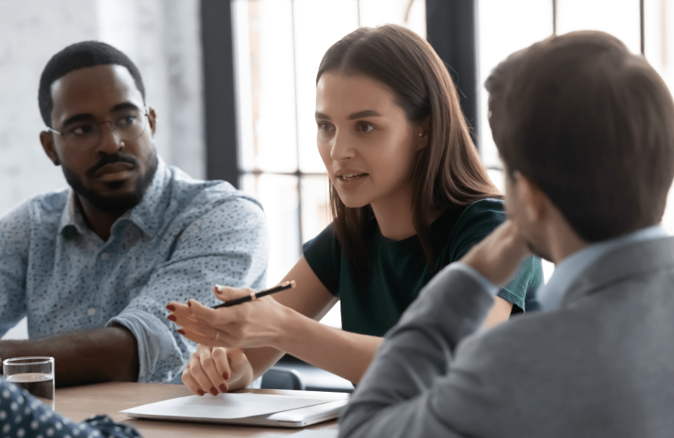 Three people sitting and having a serious conversation