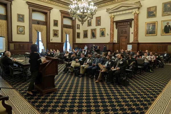 Photo of participants listening to a panel discussion held in the Mayor's Conference Room