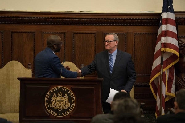 Photo Dean John L. Jackson, Jr. (left) shaking hands with Philadelphia Mayor Jim Kenney