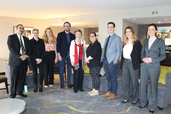 (L to R): Diami Virgilio, Lauren Bridges, Natalie Herbert, Zane Cooper, Susan Ness, Arlene Fernández, Andrew Wirzburger, Jeanna Sybert, and Helene Langlamet