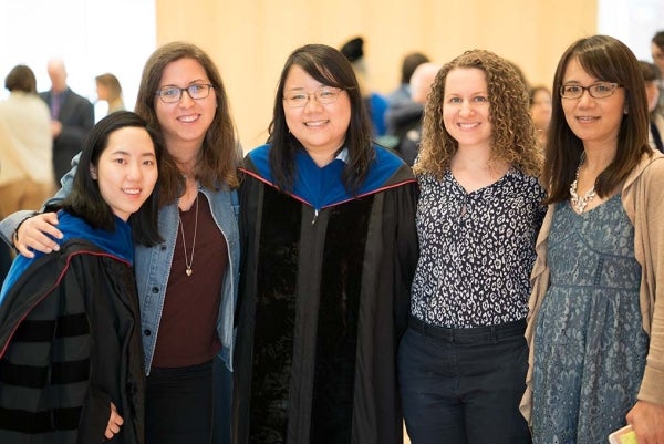 From left to right, Ph.D. Graduate Stella (Juhyun) Lee; Doctoral Student Allyson Volinsky; Ph.D. Graduate Jiaying Liu; Doctoral Student Elissa Kranzler; and Annenberg Library Assistant Min Zhong posing for the picture. They are all smiling.