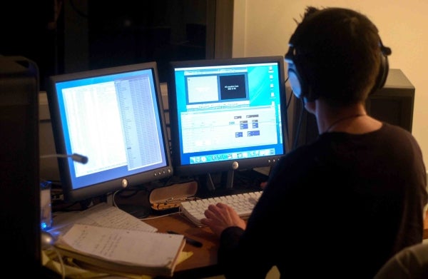 Photo of an individual working on a media lab computer.
