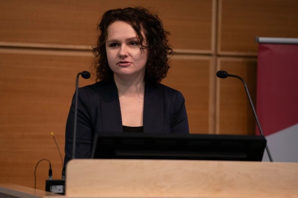 Dariya Orlova speaks at a podium