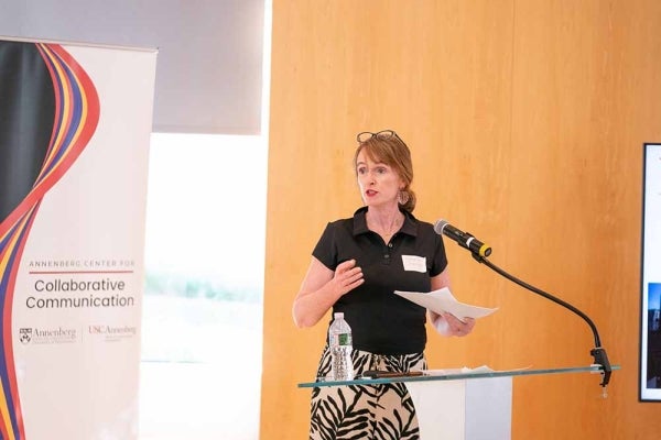 Deborah Jermyn speaking at a podium