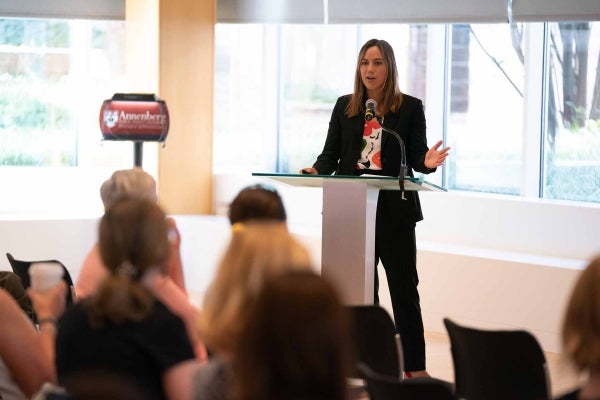 Jennifer Wong speaking at a podium