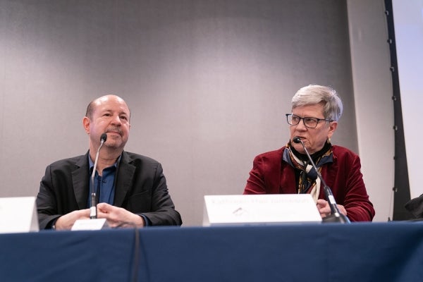 Michael Mann and Kathleen Hall Jamieson address attendees of lunchtime panel on disinformation.