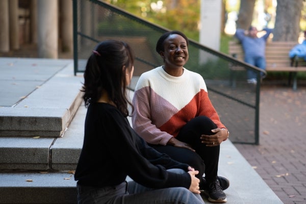 Post-doc Laetitia Mwilambwe-Tshilobo mentoring a grad student