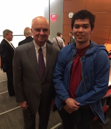 Man standing next to General Michael Hayden at an event