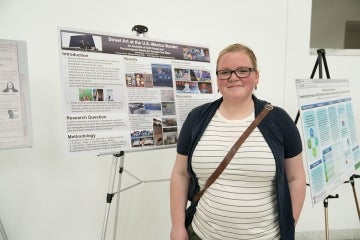 Julia Becker poses in front of their research project