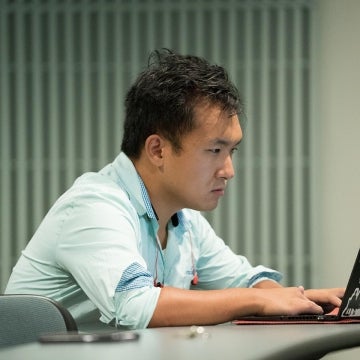 Danny Kim using laptop 