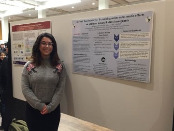 Rebecca Lopez poses in front of her research project