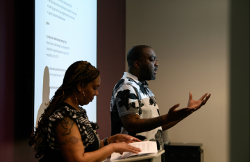 Maxayn Gooden and Oronde McClain welcome attendees to the Philadelphia Center for Gun Violence Reporting's Link Up and Info Session last May at IDEAL